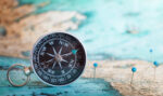 Illustrative image of compass and map.